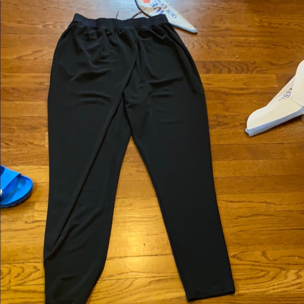 Black drape front pants